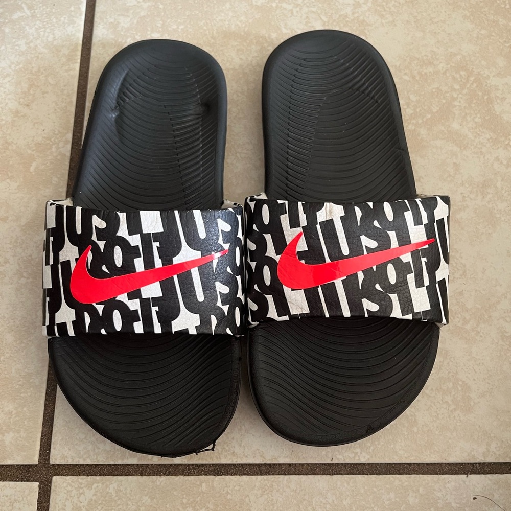 Nike Black Slides with Red Swoosh and Text Design